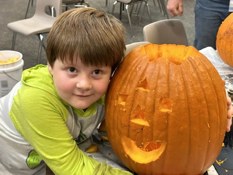 Boy with pumpkin