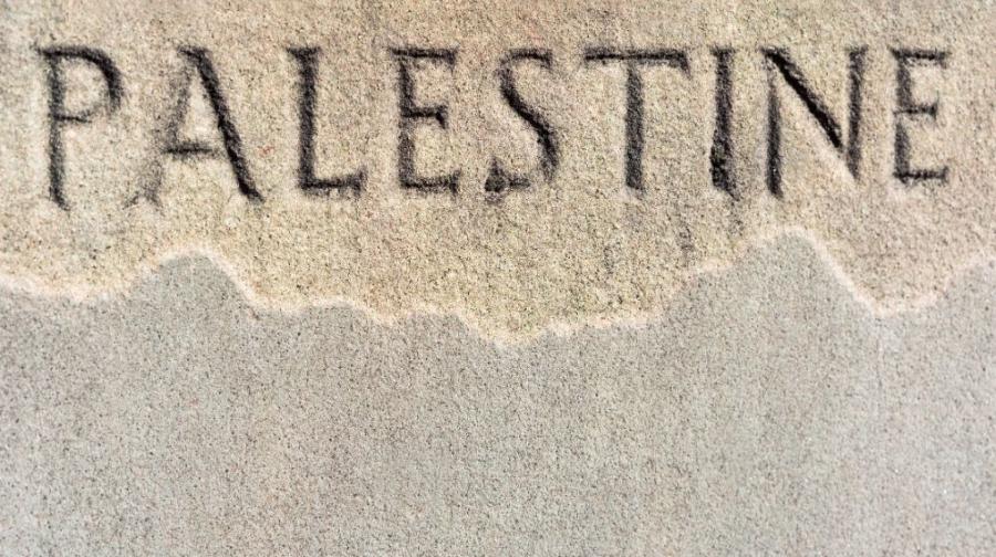 Palestine written in sand