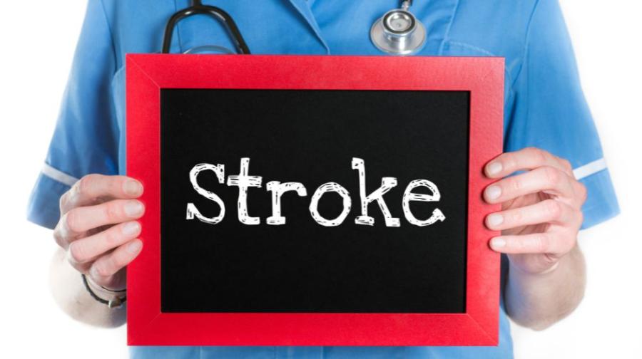 medical person holding sign saying Stroke